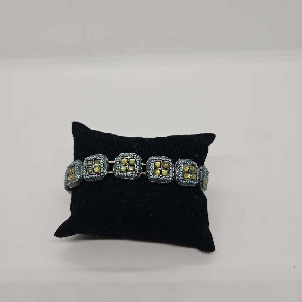 heavy silver tone stretch bracelet with blue and green squares